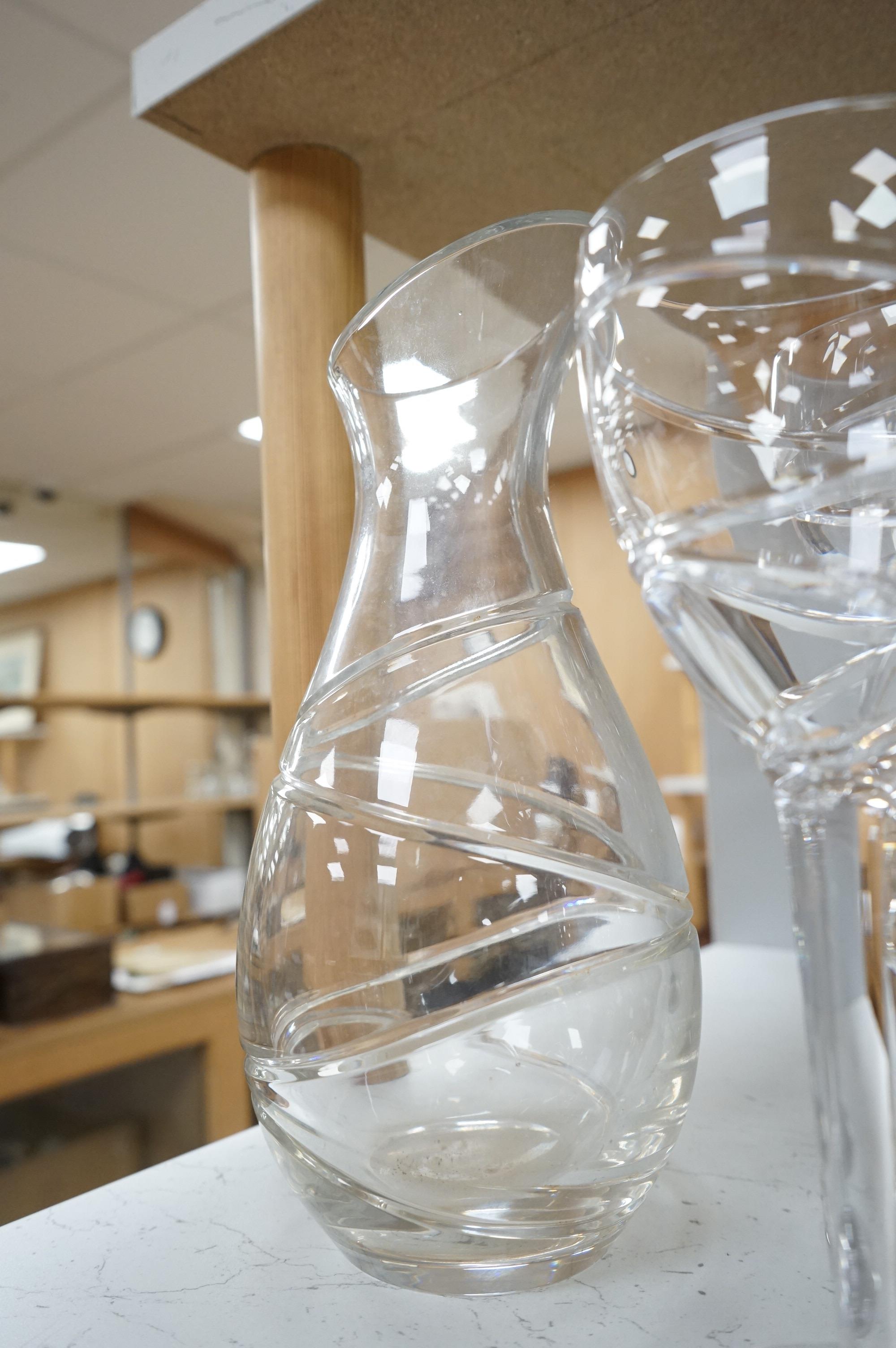Various part suites of Jasper Conran hand cut Stuart Crystal ‘Aura’ glasses. Including eight Champagne, five large wine and six smaller wine glasses and a carafe, largest 27cm high